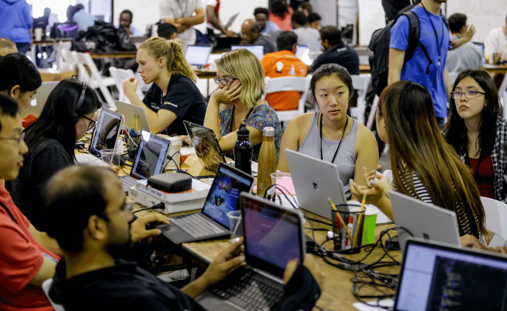 People working at a hackathon